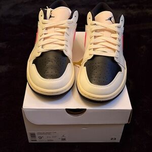 Women’s Air Jordan Black and Cream Sneakers
